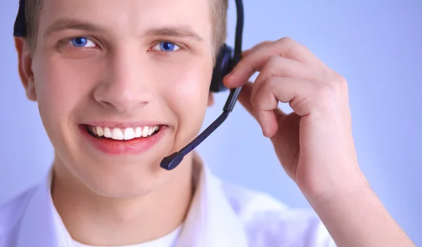 Operatore di assistenza clienti con auricolare su sfondo bianco — Foto Stock