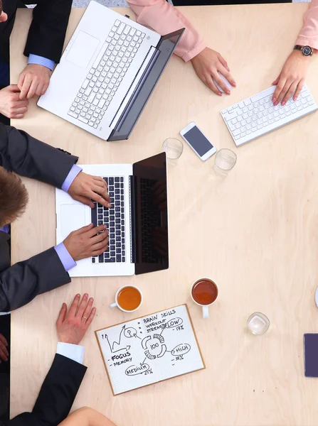 Business people sitting and discussing at business meeting, in office — Stock Photo, Image