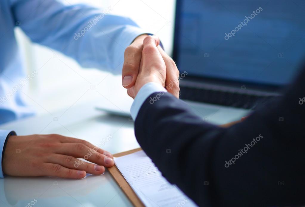 Business people shaking hands, finishing up a meeting