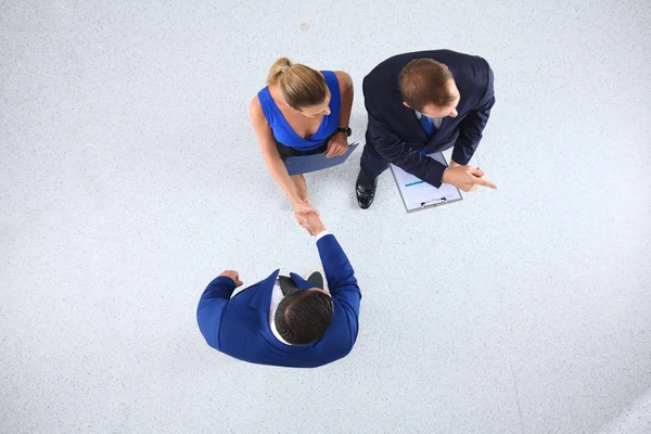 Empresários apertando as mãos - topview — Fotografia de Stock