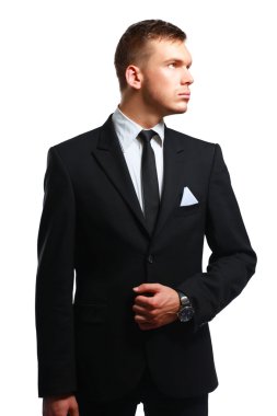 Gri arka plan üzerinde izole duran bir başarılı genç iş adamı portresi