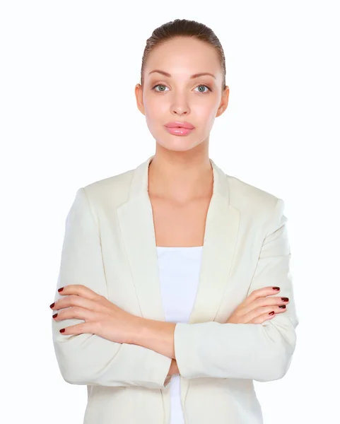 Eine junge Frau steht auf weißem Hintergrund — Stockfoto
