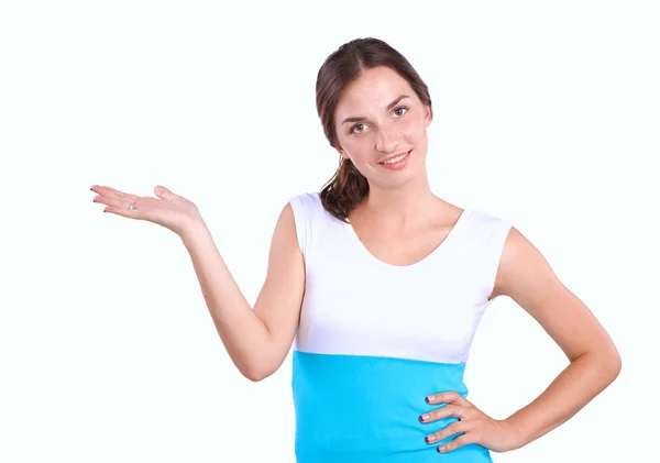 Portrait of a smiling young woman pointing up — Stock Photo, Image