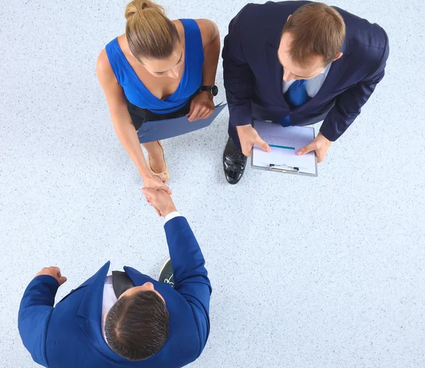 Empresários apertando as mãos - topview — Fotografia de Stock