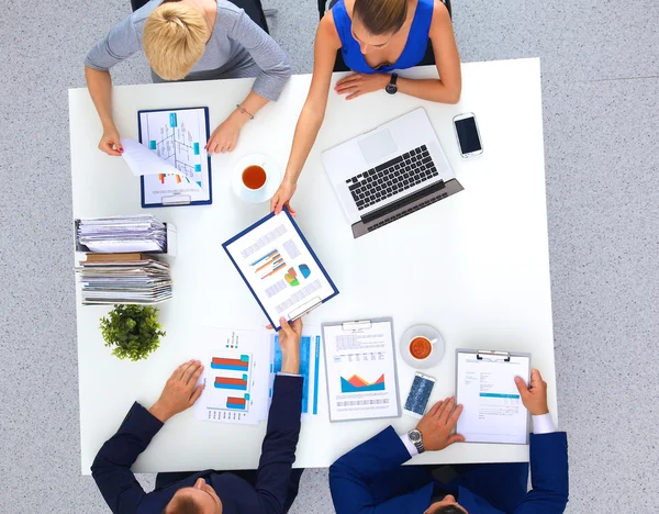 Business people sitting and discussing at business meeting, in office — Stock Photo, Image