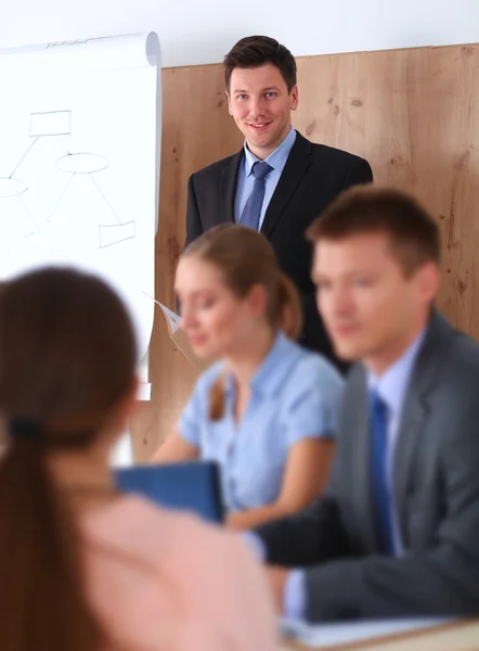 Business people sitting and discussing at business meeting, in office — Stock Photo, Image