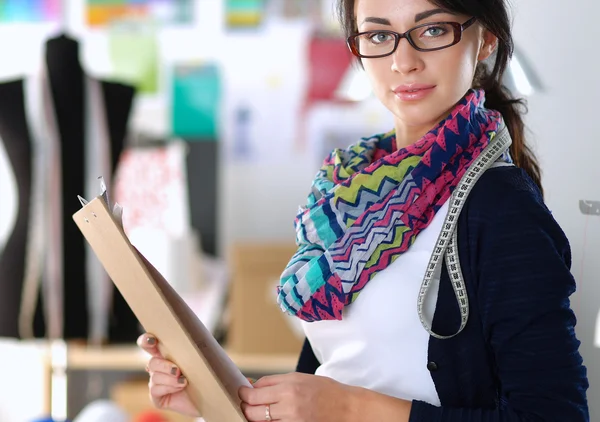 Beautiful fashion designer standing in studio — Stock Photo, Image