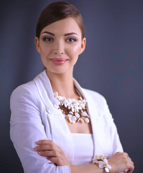 Portrait of young woman with beads, isolated on grey background — Stock Photo, Image