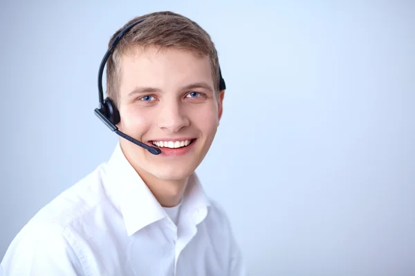 Operatore di assistenza clienti con auricolare su sfondo bianco — Foto Stock