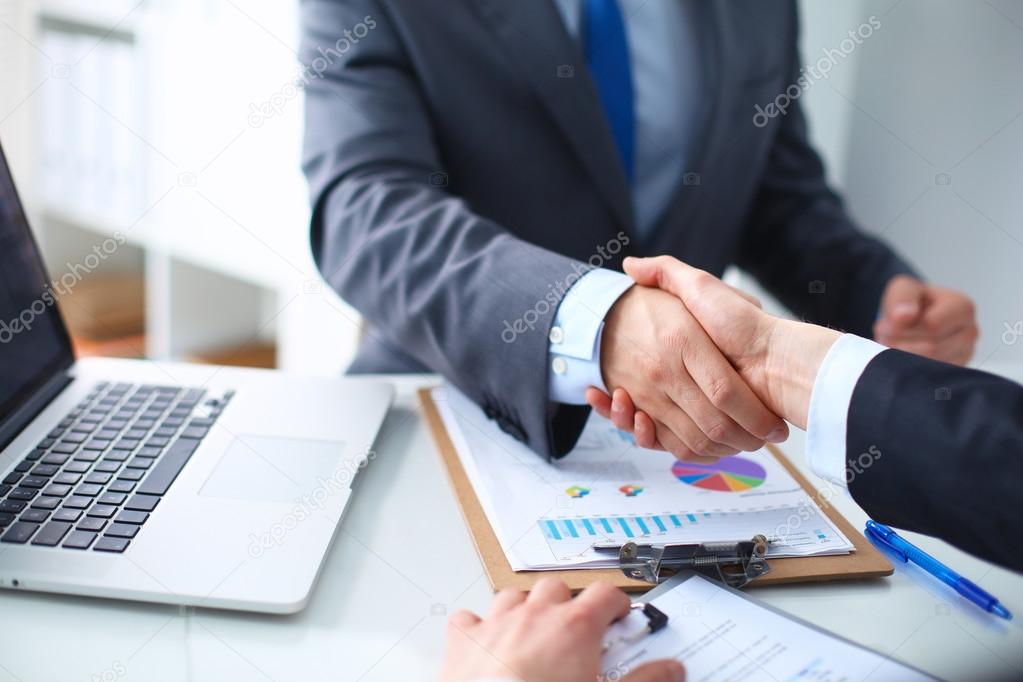 Business people shaking hands, finishing up a meeting