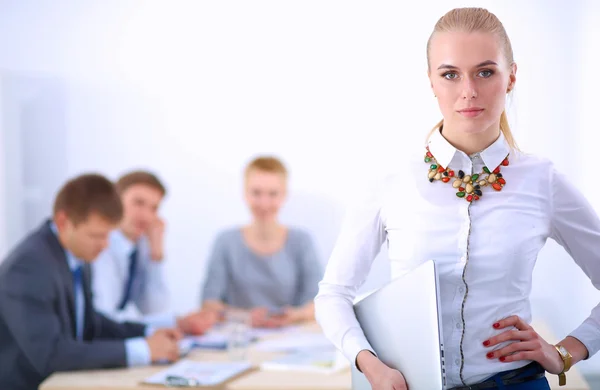 Portrait of a young woman working at office standing — Stock Photo, Image