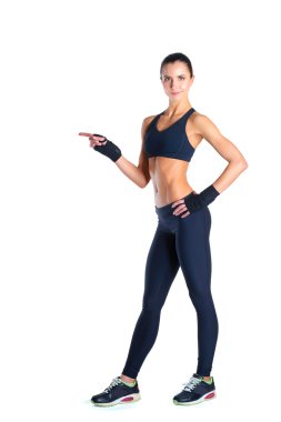 Beyaz arka plan karşı spor giyim poz kas genç kadın