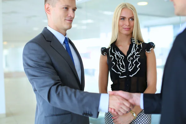 Business people shaking hands after meeting — Stock Photo, Image