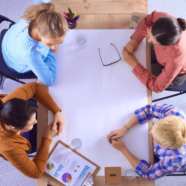 Business people sitting and discussing at business meeting, in office — Stock Photo, Image