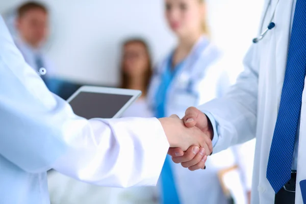 Young medical people handshaking at office — Stock Photo, Image