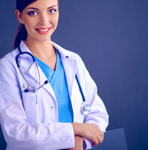 Doctor woman with stethoscope isolated on grey background — Stock Photo, Image