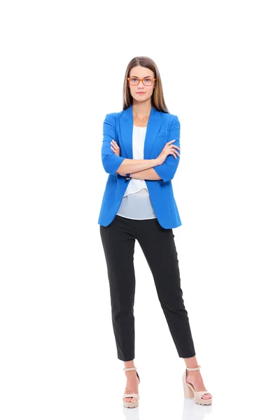 Portrait of a confident young woman standing isolated on white background. — Stock Photo, Image