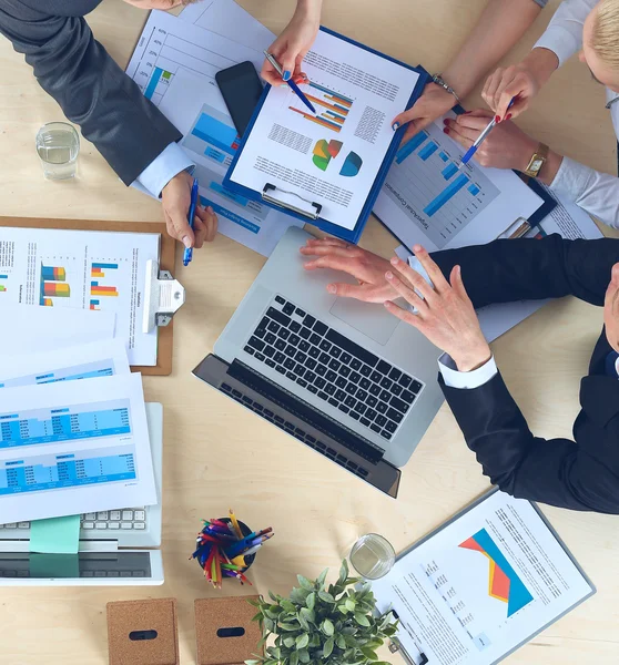 Business people sitting and discussing at business meeting, in office — Stock Photo, Image