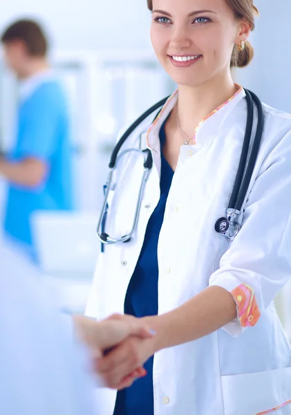 Young medical people handshaking at office Stock Picture