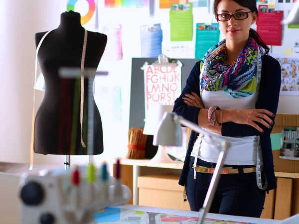 Beautiful fashion designer standing in studio — Stock Photo, Image