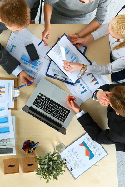 Business people sitting and discussing at business meeting, in office — Stock Photo, Image