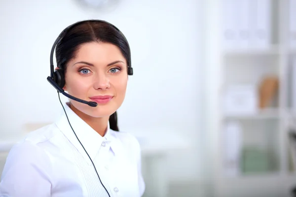 Close-up portrait of a customer service agent sitting at office — Stock Photo, Image