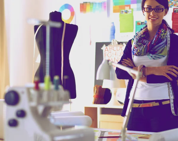 Beautiful fashion designer standing in studio — Stock Photo, Image