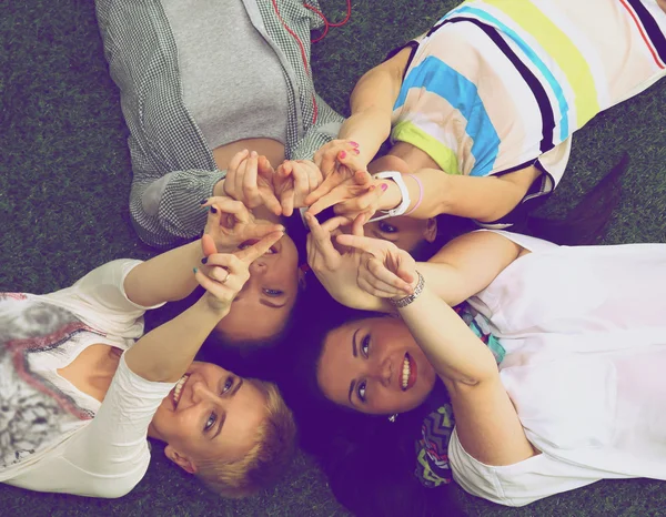 Group of friends with their hands in the ai — Stock Photo, Image