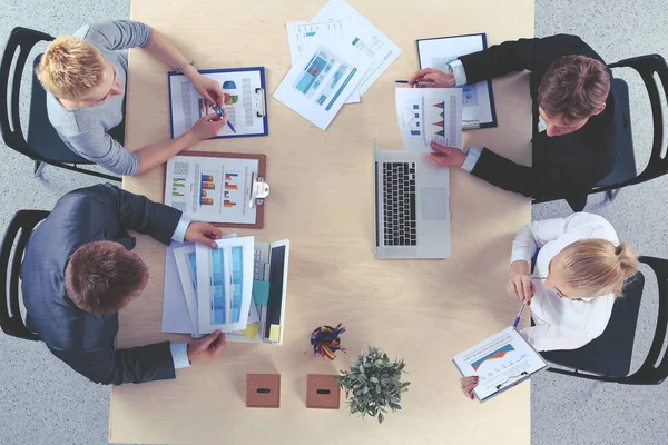 Business people sitting and discussing at business meeting, in office — Stock Photo, Image