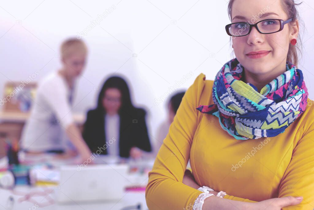 Portrait of a young woman working at office