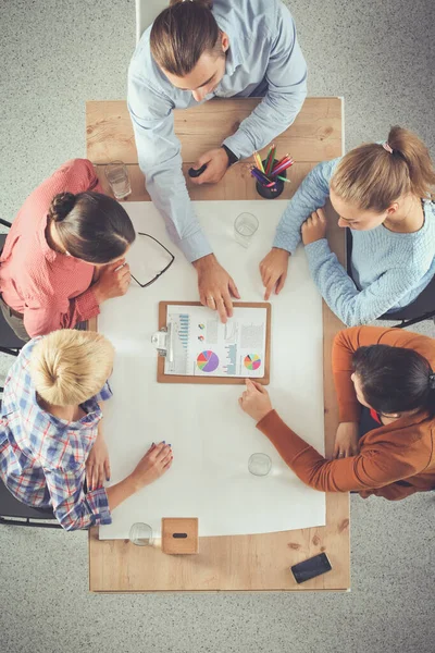 Business people sitting and discussing at meeting, in office — Stock Photo, Image