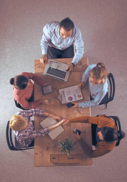 Business people sitting and discussing at business meeting, in office — Stock Photo, Image