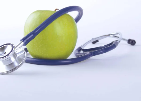 Stethoscope and green apple isolated on white background — Stock Photo, Image