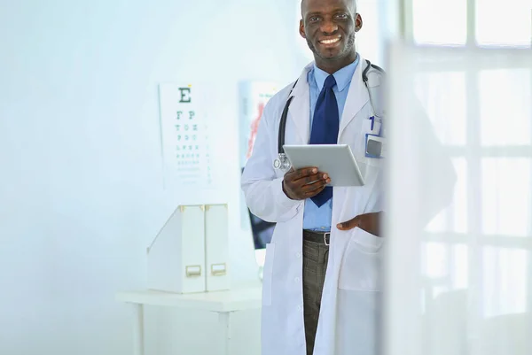 Portrait young african medical doctor holding patients x-ray — Stock Photo, Image