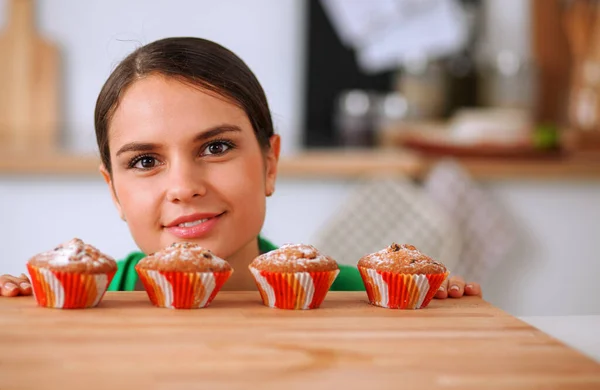 Beautiful young woman cooking in kitchen at home — Stock Photo, Image