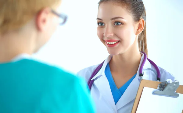 Woman doctor standing with stethoscope at hospital — Stock Photo, Image