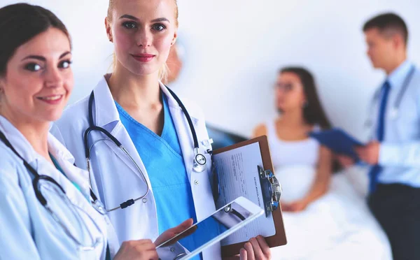 Young woman doctor holding a tablet pc — Stock Photo, Image