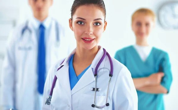 Woman doctor standing with stethoscope at hospital — Stock Photo, Image