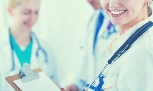 Attractive female doctor in front of medical group — Stock Photo, Image