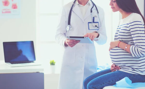 Beautiful smiling pregnant woman with the doctor at hospital — Stock Photo, Image