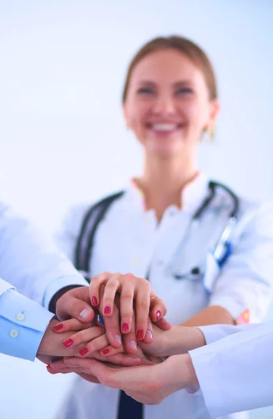 Doctors and nurses in a medical team stacking hands — Stock Photo, Image