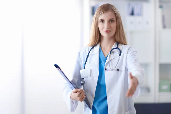 Welcoming doctor with hand extended — Stock Photo, Image