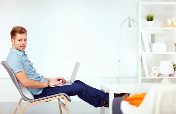 Goodlooking young man relaxing at home — Stock Photo, Image