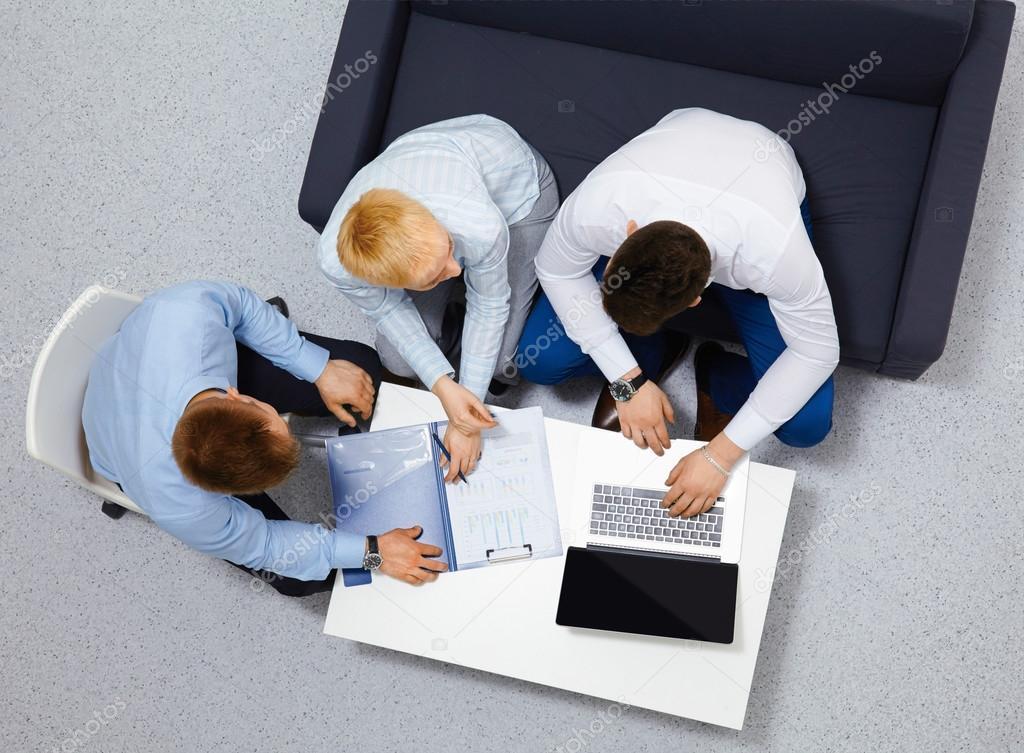 overhead view of people having business meeting