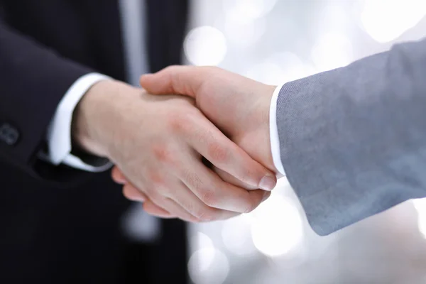 Businessmen shaking hands, isolated on white. — Stock Photo, Image