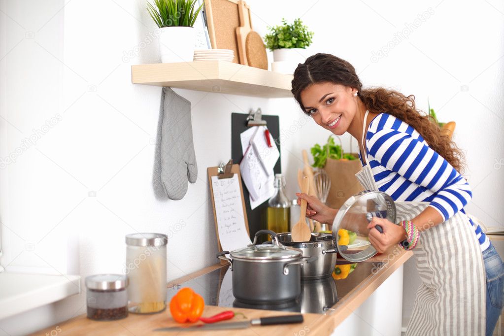 Young woman in the kitchen preparing a food