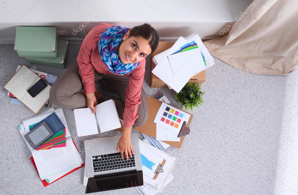 Modern young fashion designer working at studio.