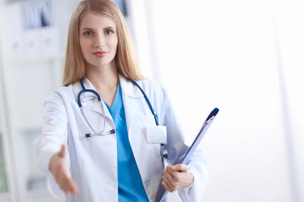 Welcoming doctor with hand extended — Stock Photo, Image