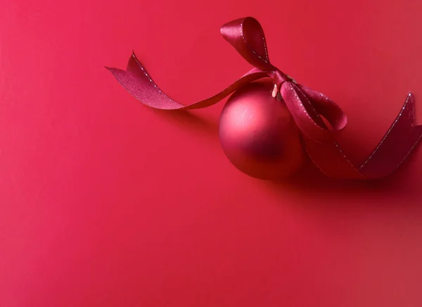 Red christmas ball, isolated on red background. — Stock Photo, Image