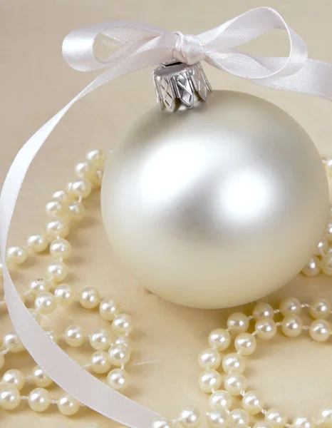 Christmas ball and beads. — Stock Photo, Image